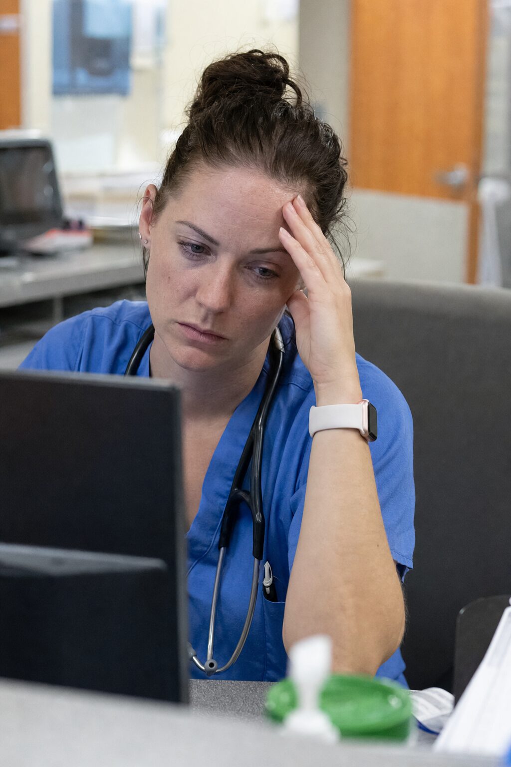 A nurse on the floor, composed and matter-of-fact
